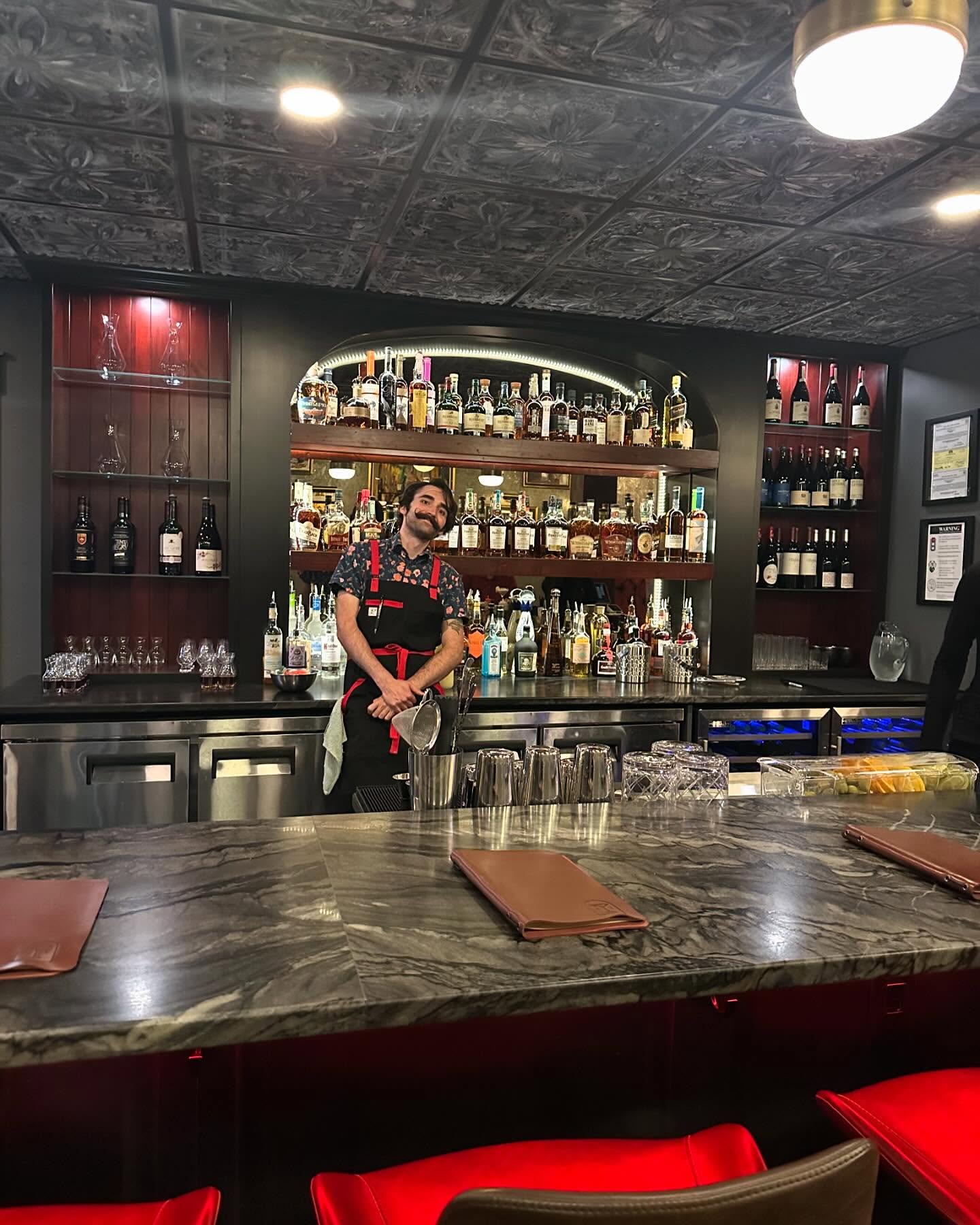 Rouge 41 — accent-lit liquor shelves